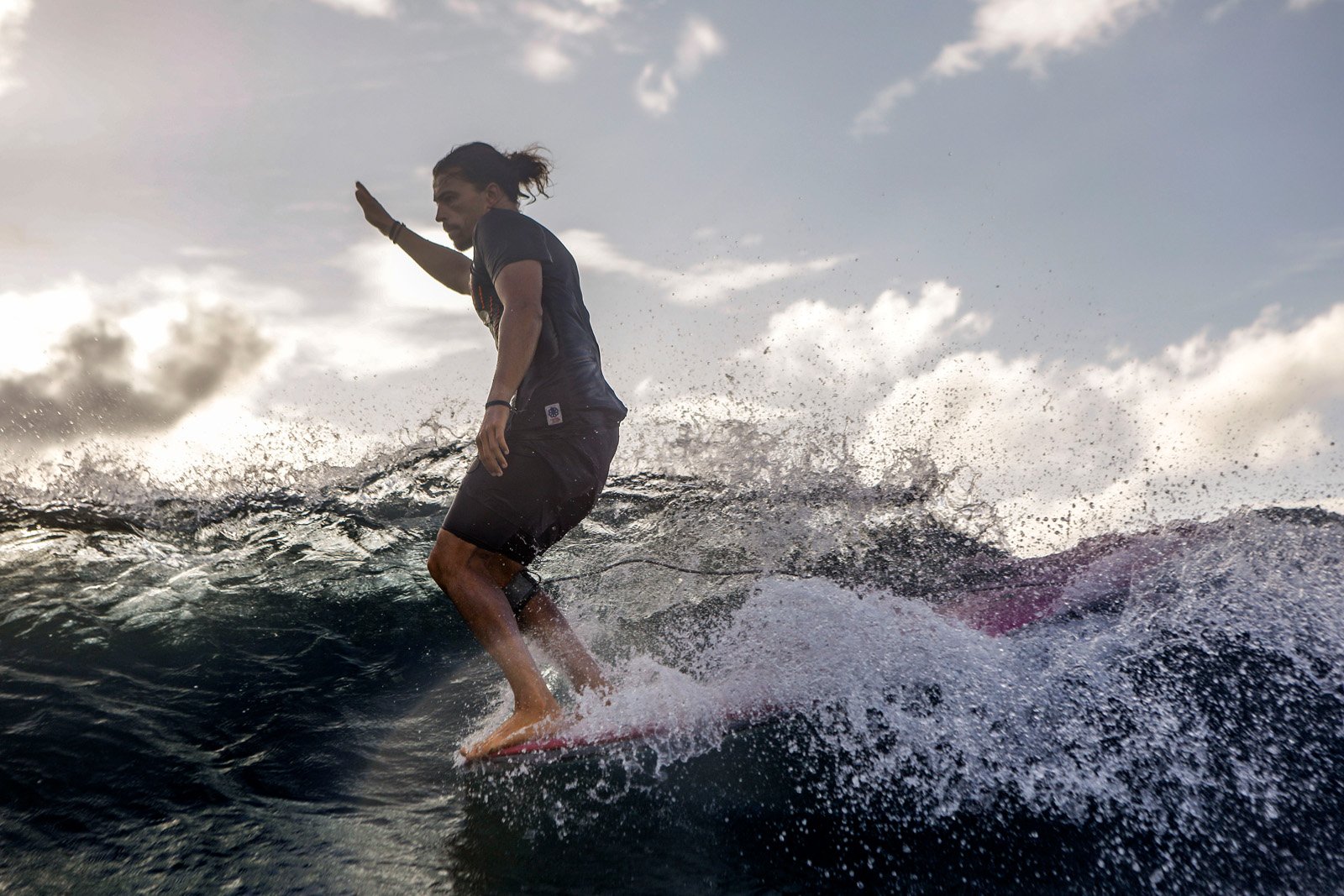 Delpero Longboard Pro surfer doing noseride