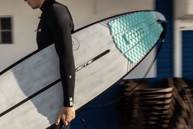 Surfer with Roam Tailpad on ACT Torq Surfboard