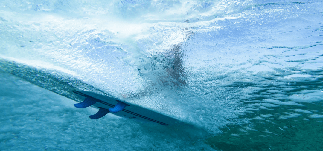 Torq surfboard from below with Roam surf fins